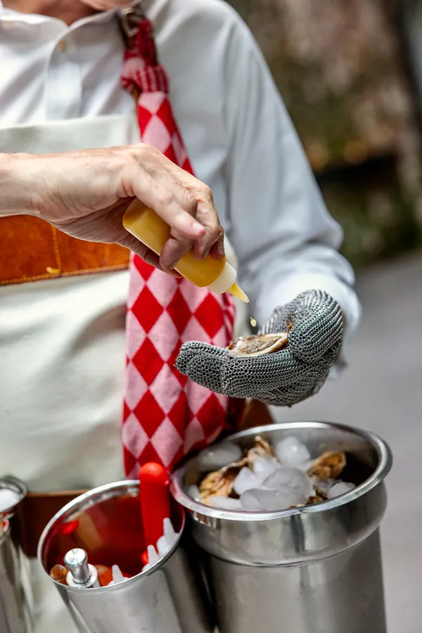 Oysters being shucked at a corporate event catered by Bartleby & Sage