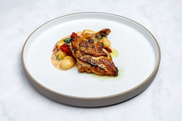 French cut chicken with gnocchi, plated by Bartleby & Sage