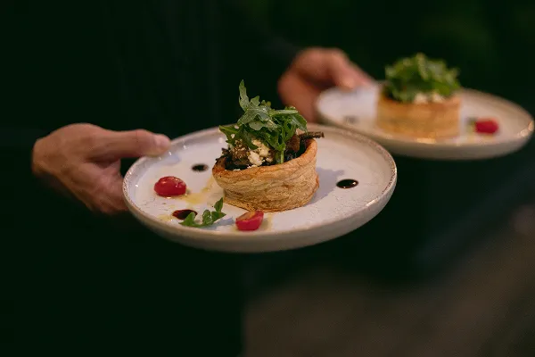 A savory tart served as a first course at a Bartleby & Sage wedding
