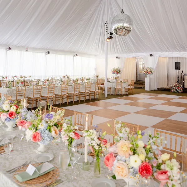 Reception space and dance floor for a wedding catered and styled by Bartleby & Sage at Wainwright House.