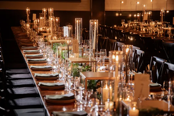 A family-style tablescape with risers, styled by Bartleby & Sage.