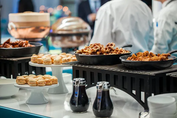 A chicken and waffle station catered by Bartleby & Sage.