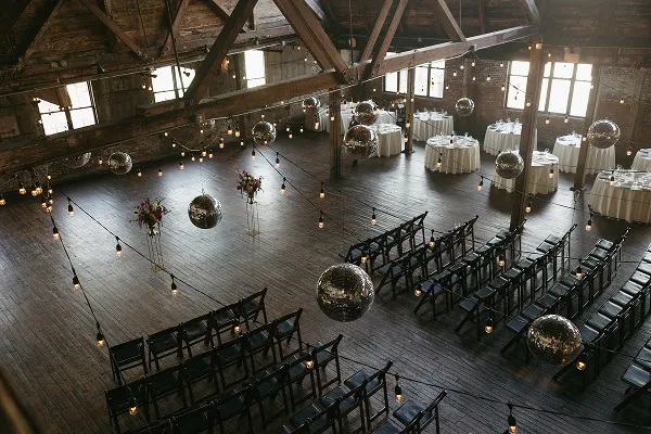 Greenpoint Loft decorated with disco balls for an event catered by Bartleby & Sage.
