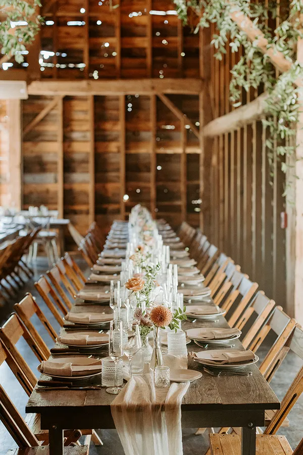 A rustic reception styled by Bartleby & Sage in a barn venue.