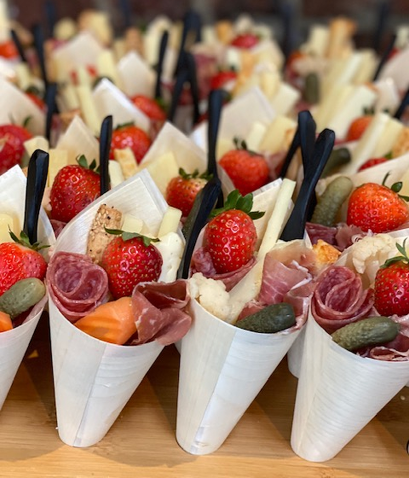Paper cones full of delicious bites made for a corporate event by the chefs at Bartleby & Sage.