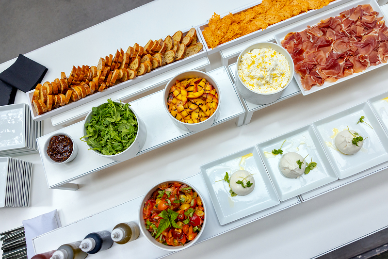 A burrata bar with meat and vegetables prepared by the chefs at Bartleby & Sage for an all-day corporate event.