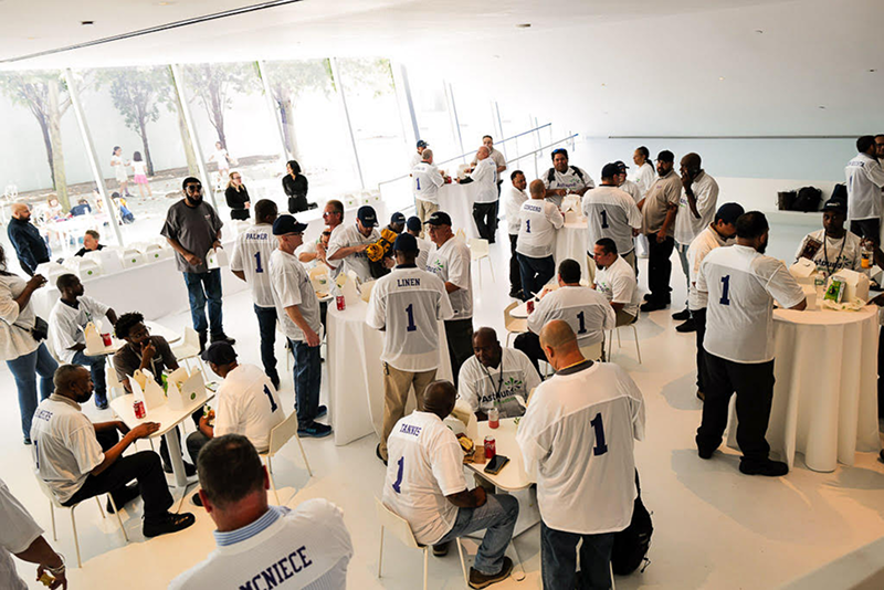 Tables, chairs and branded drop-off boxes prepared by Bartleby & Sage for an all-day corporate event. 