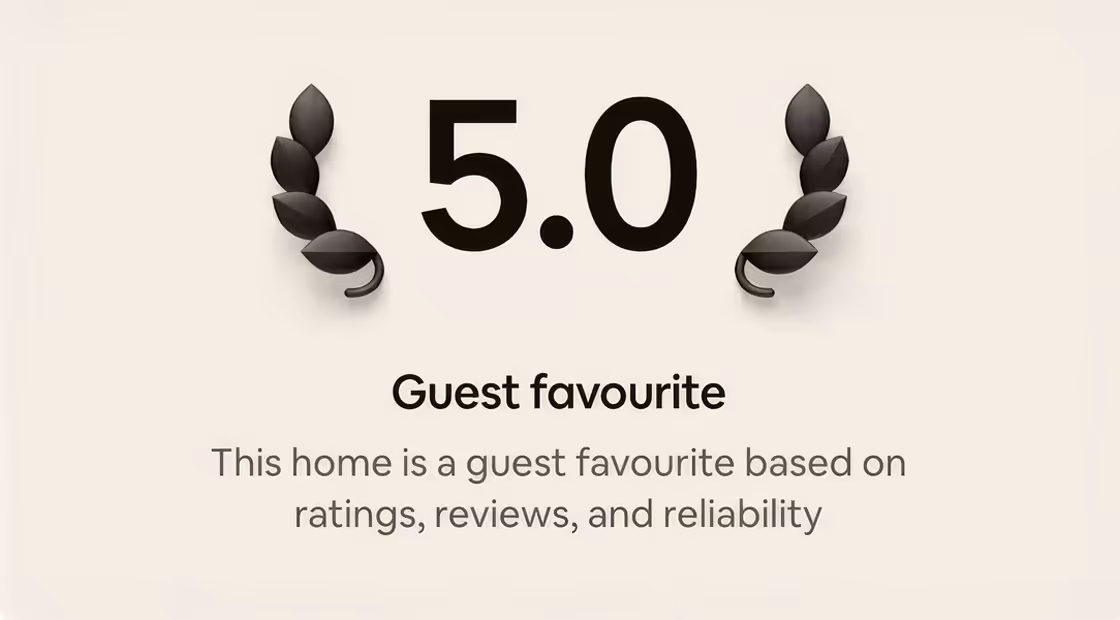 5.0 rating with laurel leaves showing a guest favourite home based on reviews and reliability.