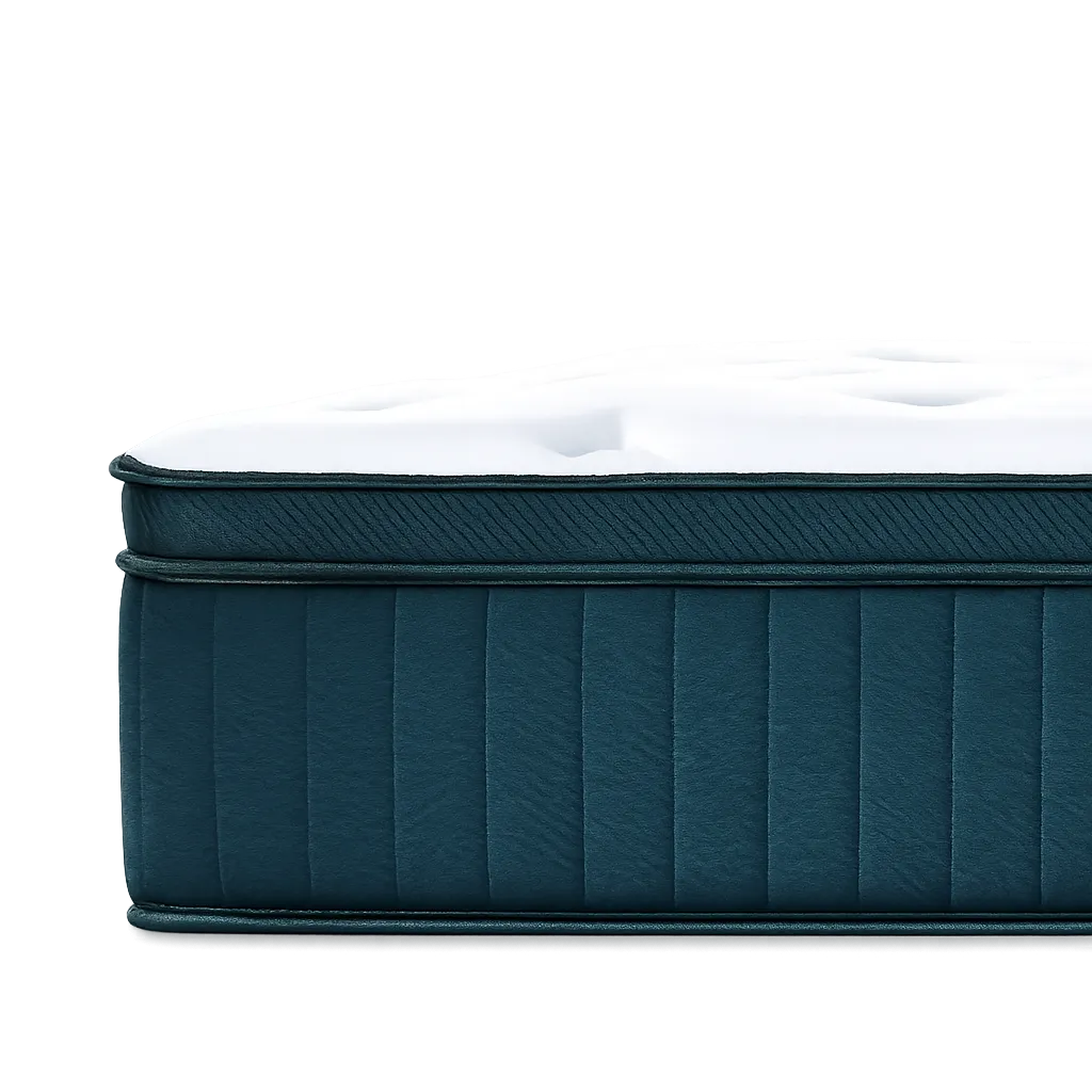 Side view of a blue and white plush mattress with stitched patterns on top and sides.