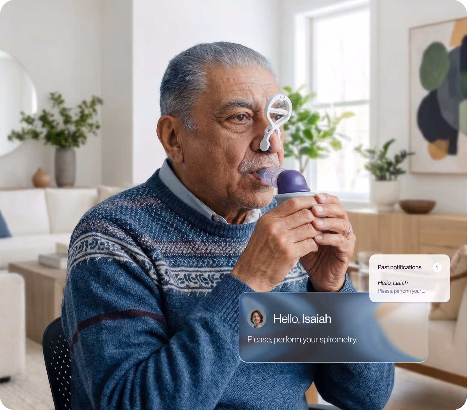 Older man in a blue sweater using a spirometry device for a lung function test in a living room.