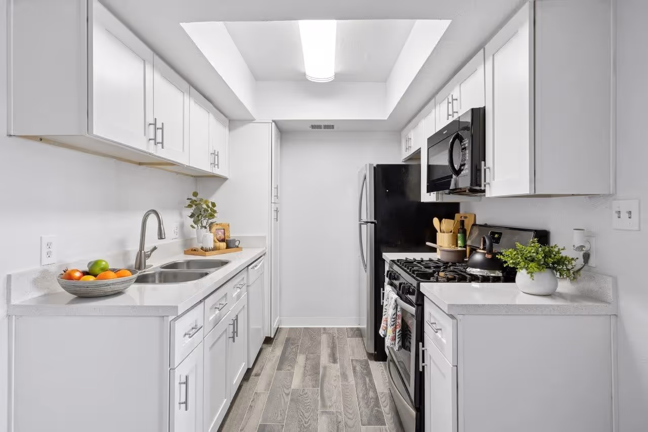 Kitchen with white cabinets and stainless steel appliances