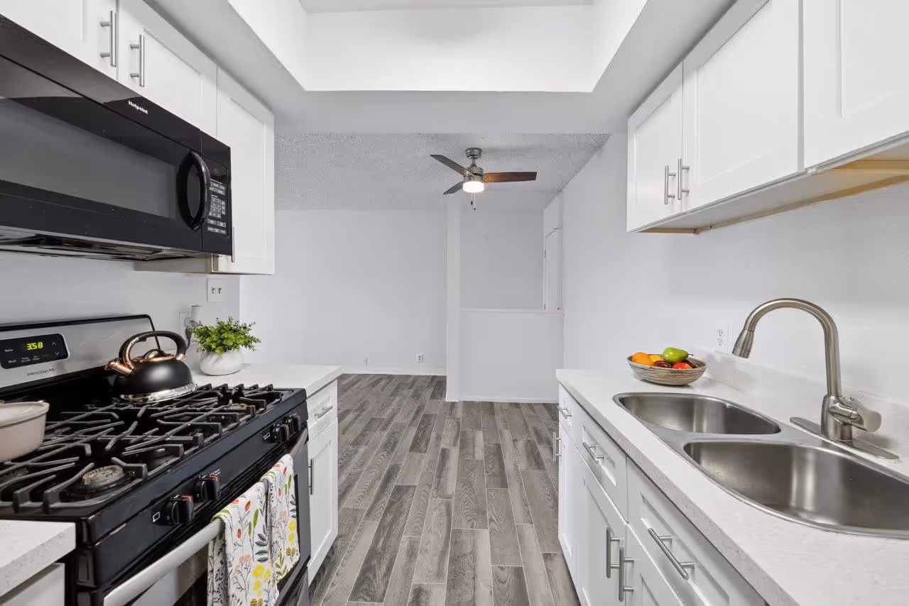 Kitchen with white cabinets and stainless steel appliances