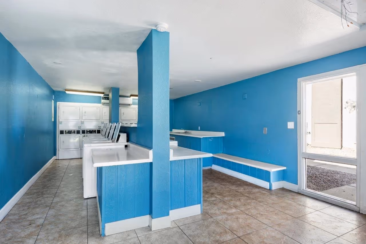 Laundry facilities with white appliances