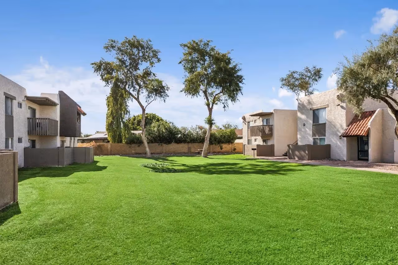 Exterior with lush greenery and palm trees