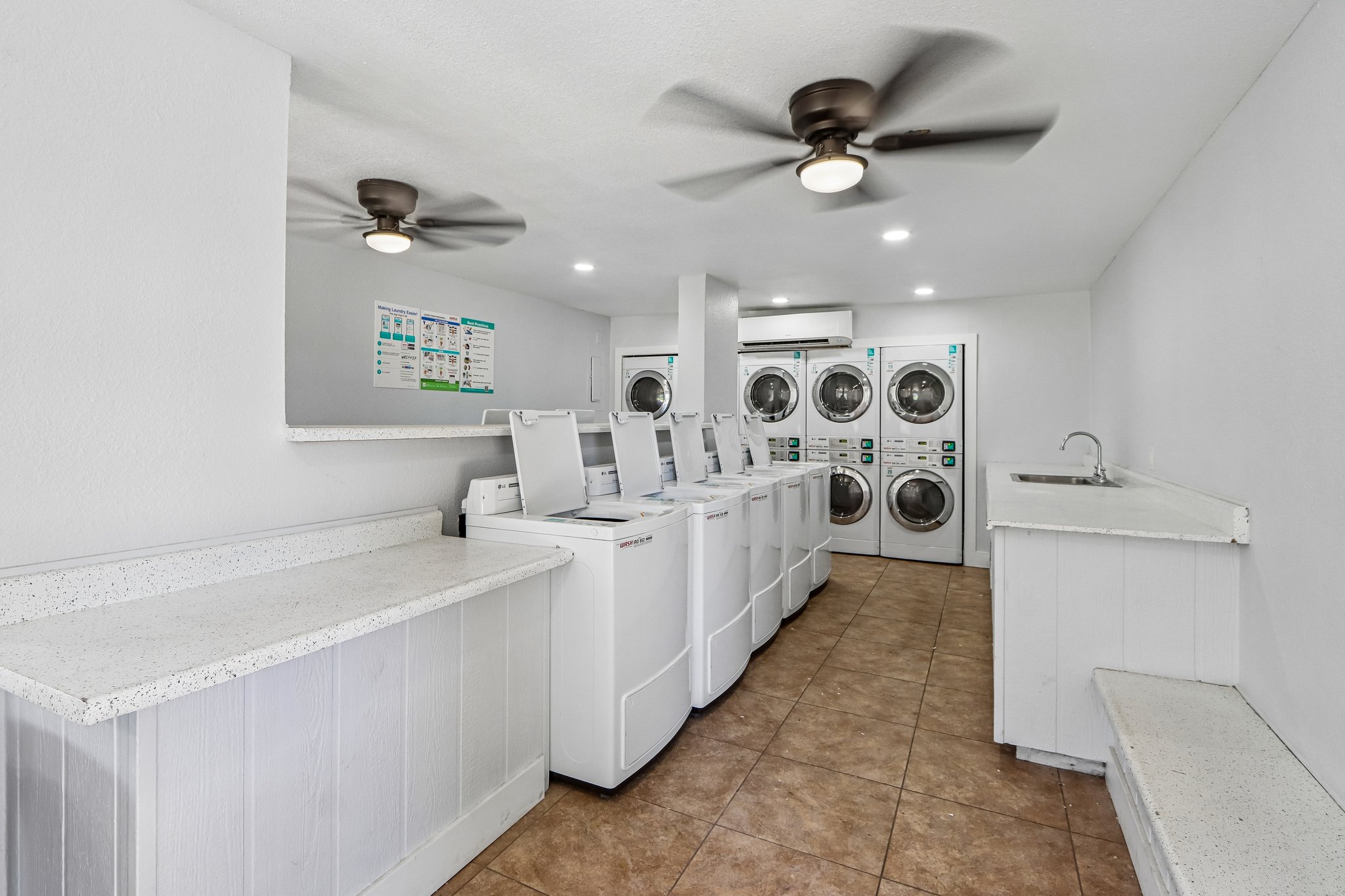 Laundry facilities with white appliances