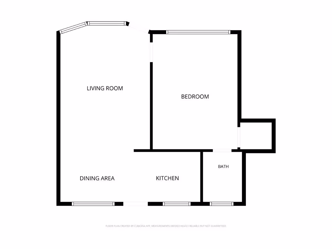 Floor plan showing living room, bedroom, dining area, kitchen, and bath with bold black walls.
