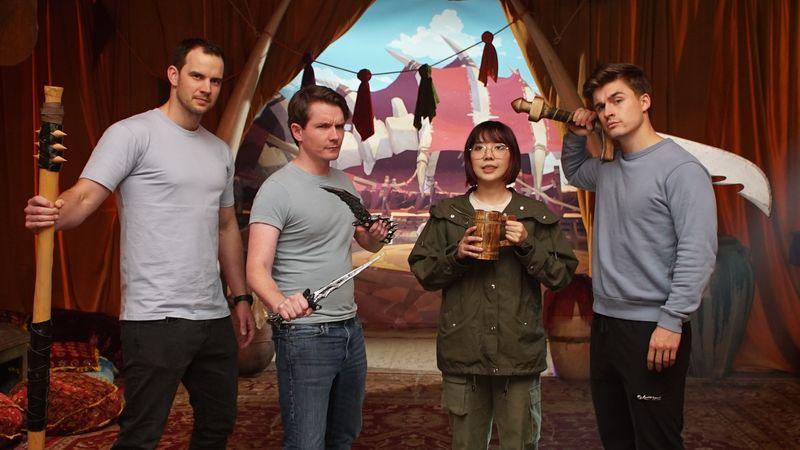 Creators pose with props on a themed AFK Journey set at the Lilith Games launch event produced by Blue Coast