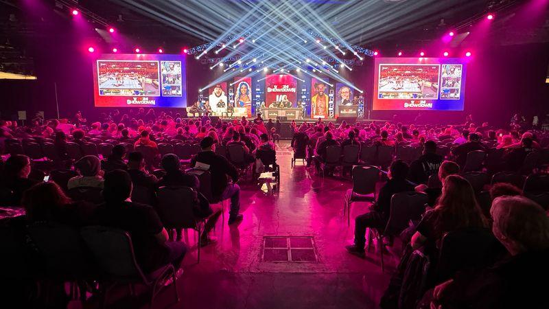 Audience watches the WWE 2K WrestleMania Showdown main stage with LED screens and concert lighting, live event produced by Blue Coast