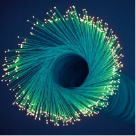 A close up of a green and white firework.