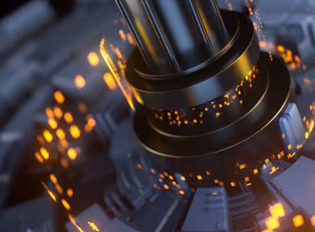 Close-up of metallic industrial machine part with glowing orange sparks around it.