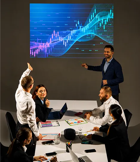 A group of people sitting around a table.
