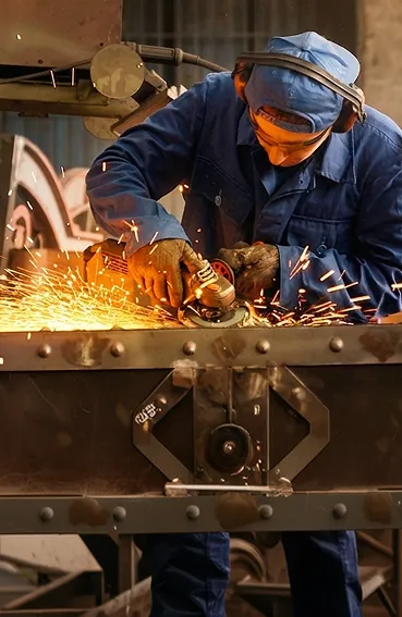 A man working on a piece of metal.