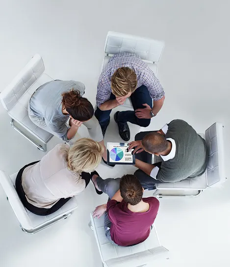 A group of people sitting around a table.