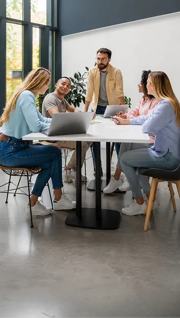 A group of people sitting around a table.