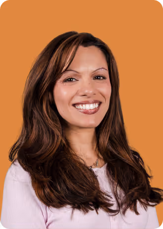 Woman with long brown hair smiling.