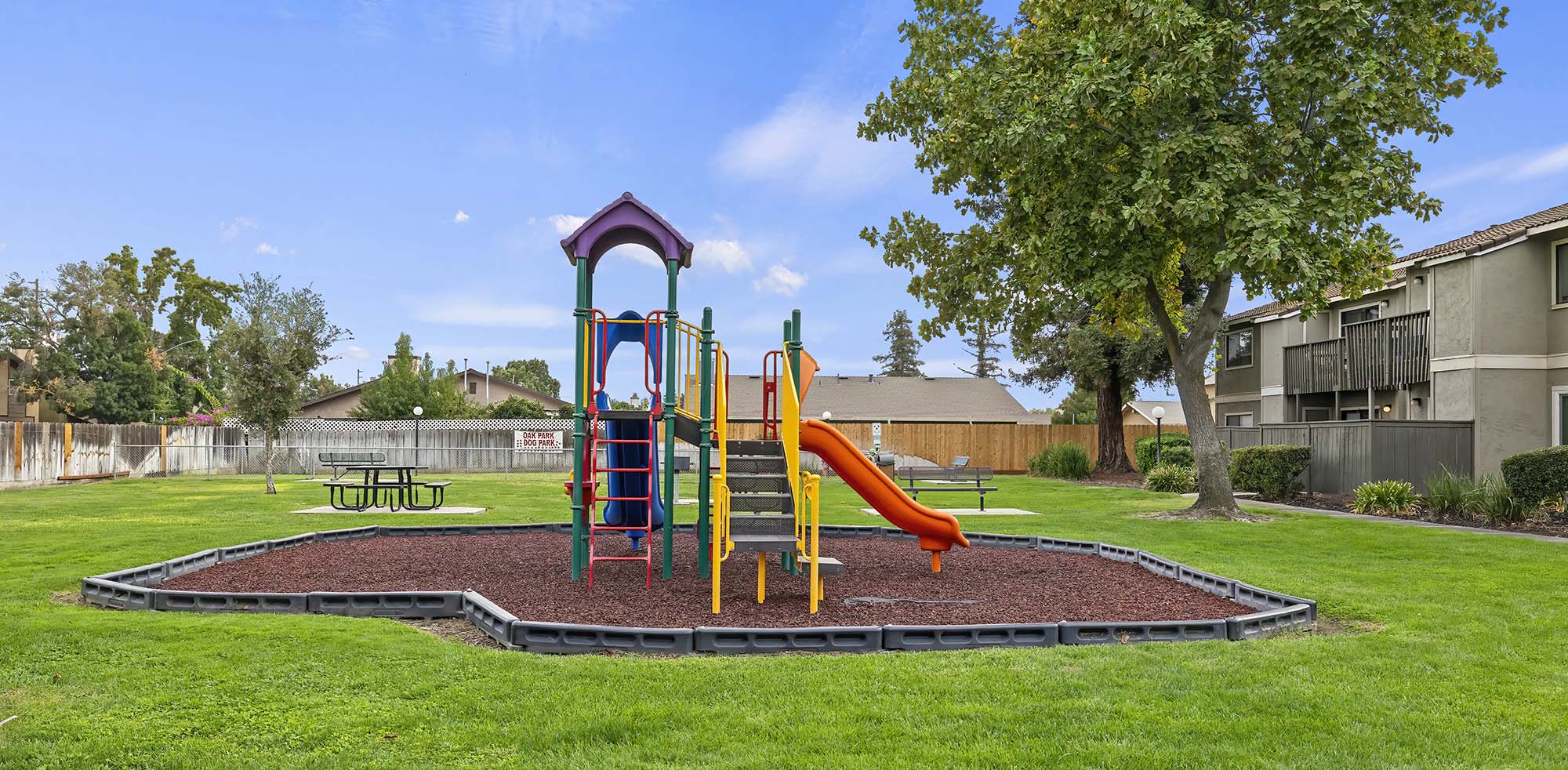 Playground near grass and building 