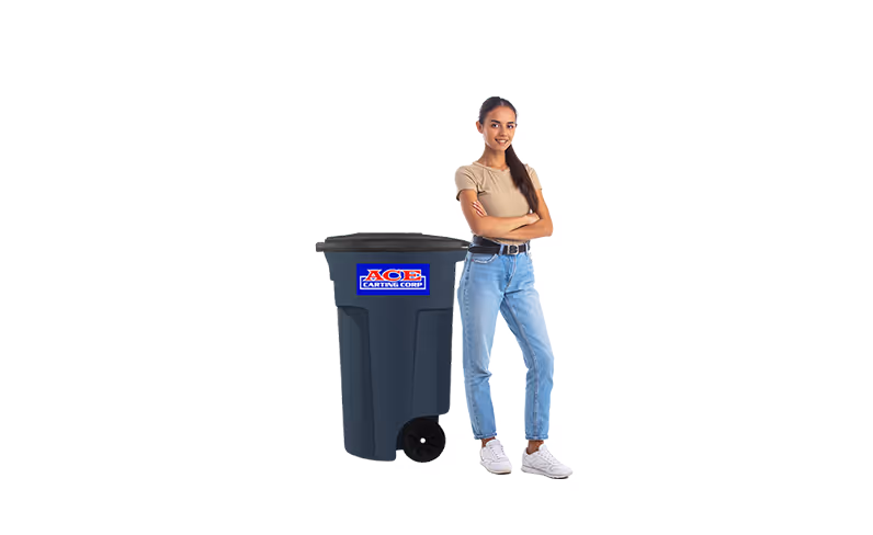 Smiling man with arms crossed standing next to a large dark blue Ace Carting Corp plastic trash bin with wheels.