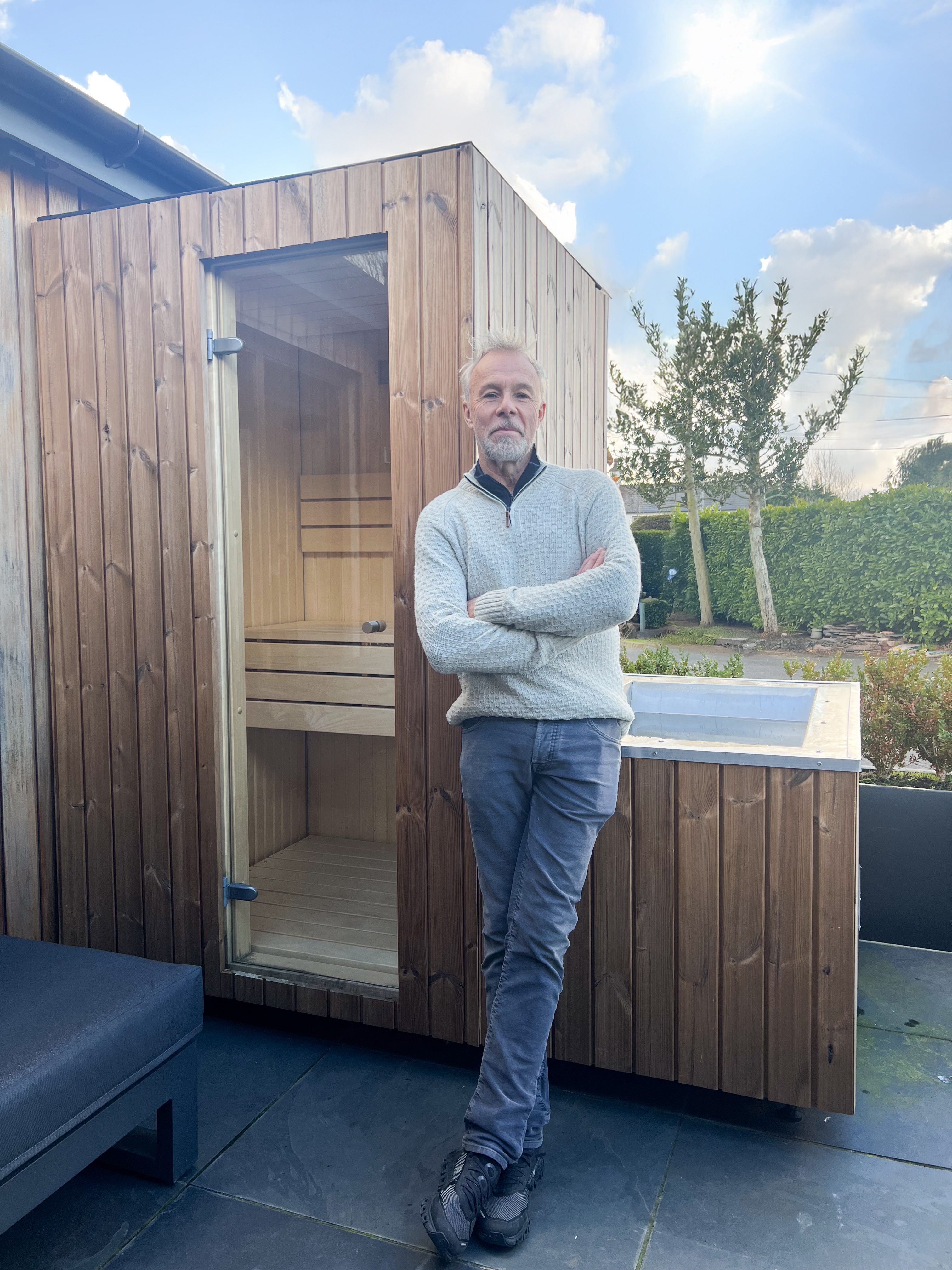 Simon, Airbnb host, beside his hoc sauna in the Lake District