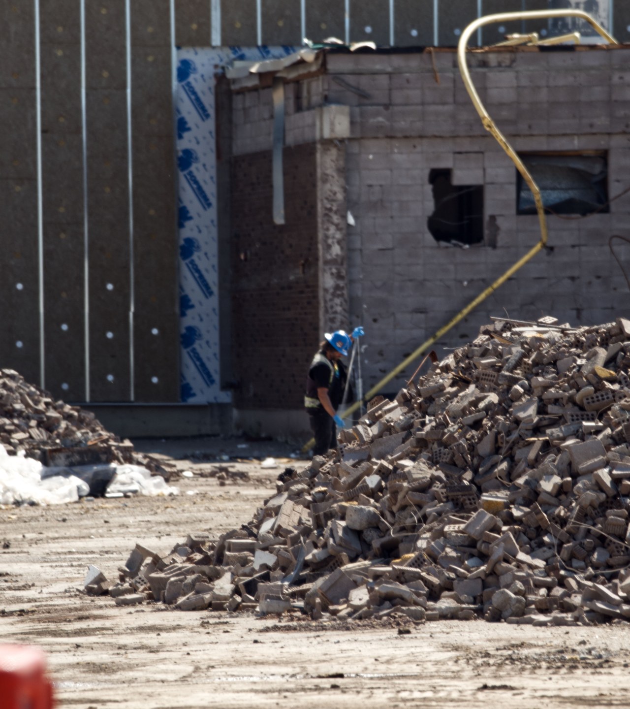 Crew working the block pile beside the live lot