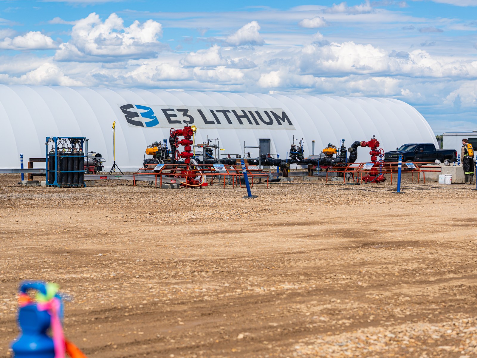 Wellheads and piping in front of the E3 Lithium process dome