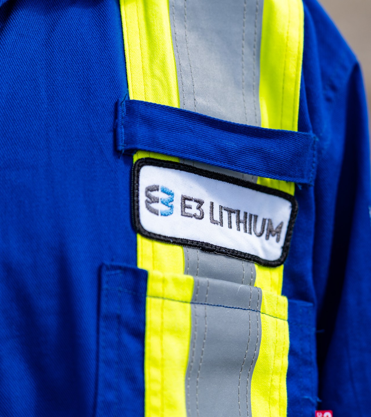 An E3 Lithium patch on a worker's flame-resistant coveralls