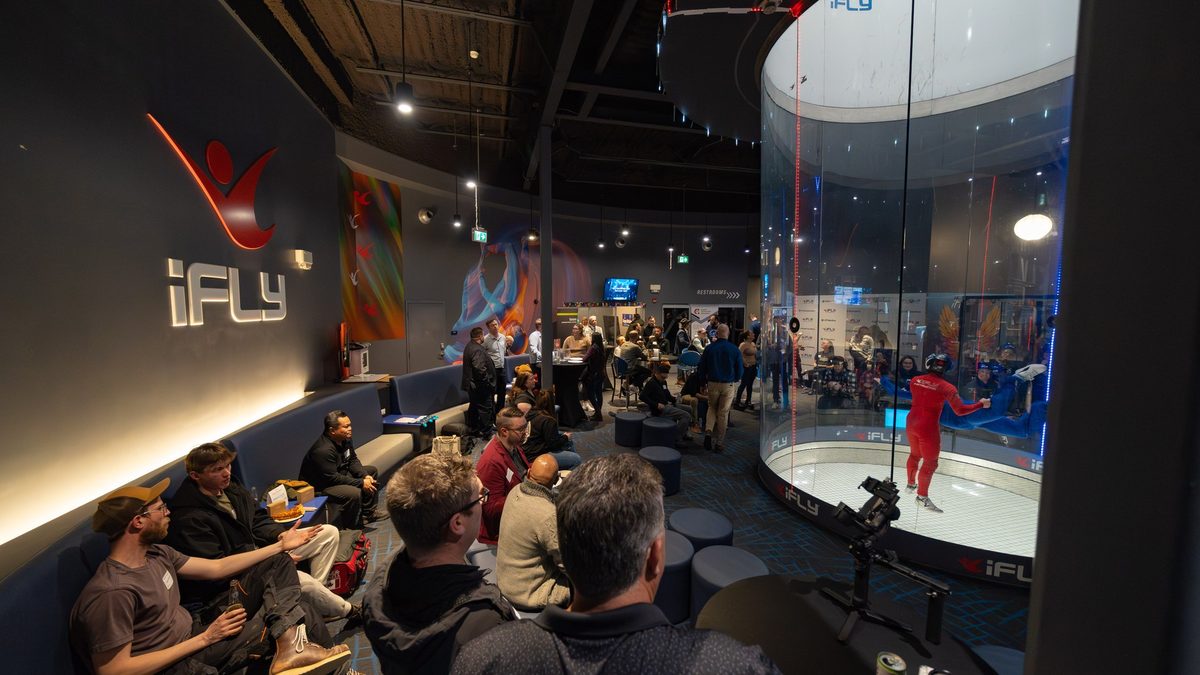 CCA Connect attendees watching a flyer in the iFLY wind tunnel, Calgary