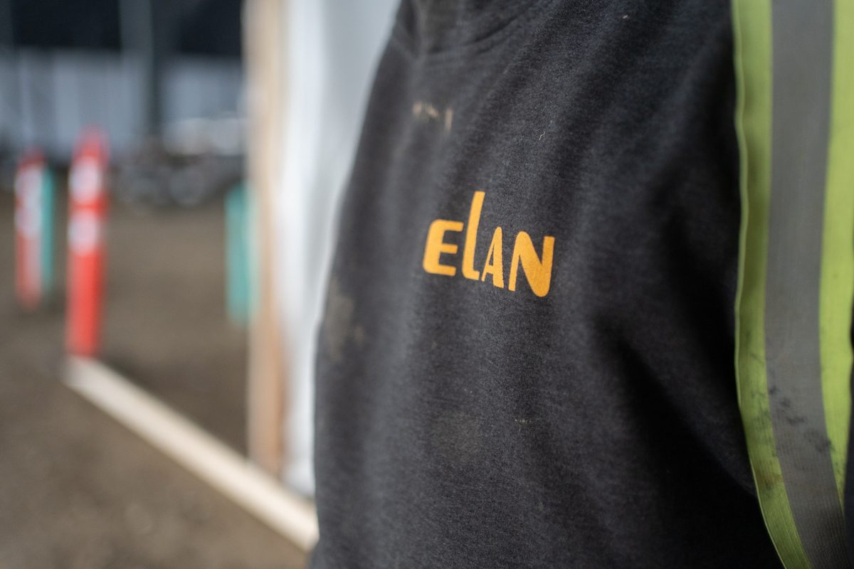 Elan Construction logo on a crew member's shirt at the Starfield 4/5 slab pour