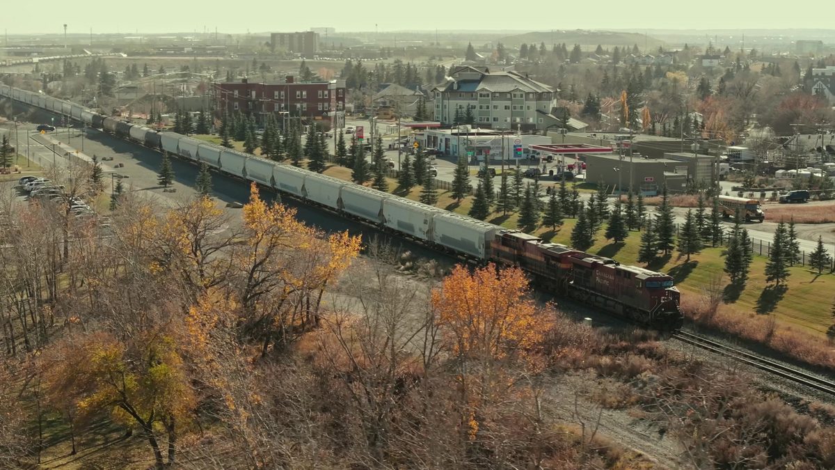 CPKC unit train passing the Calgary heritage row