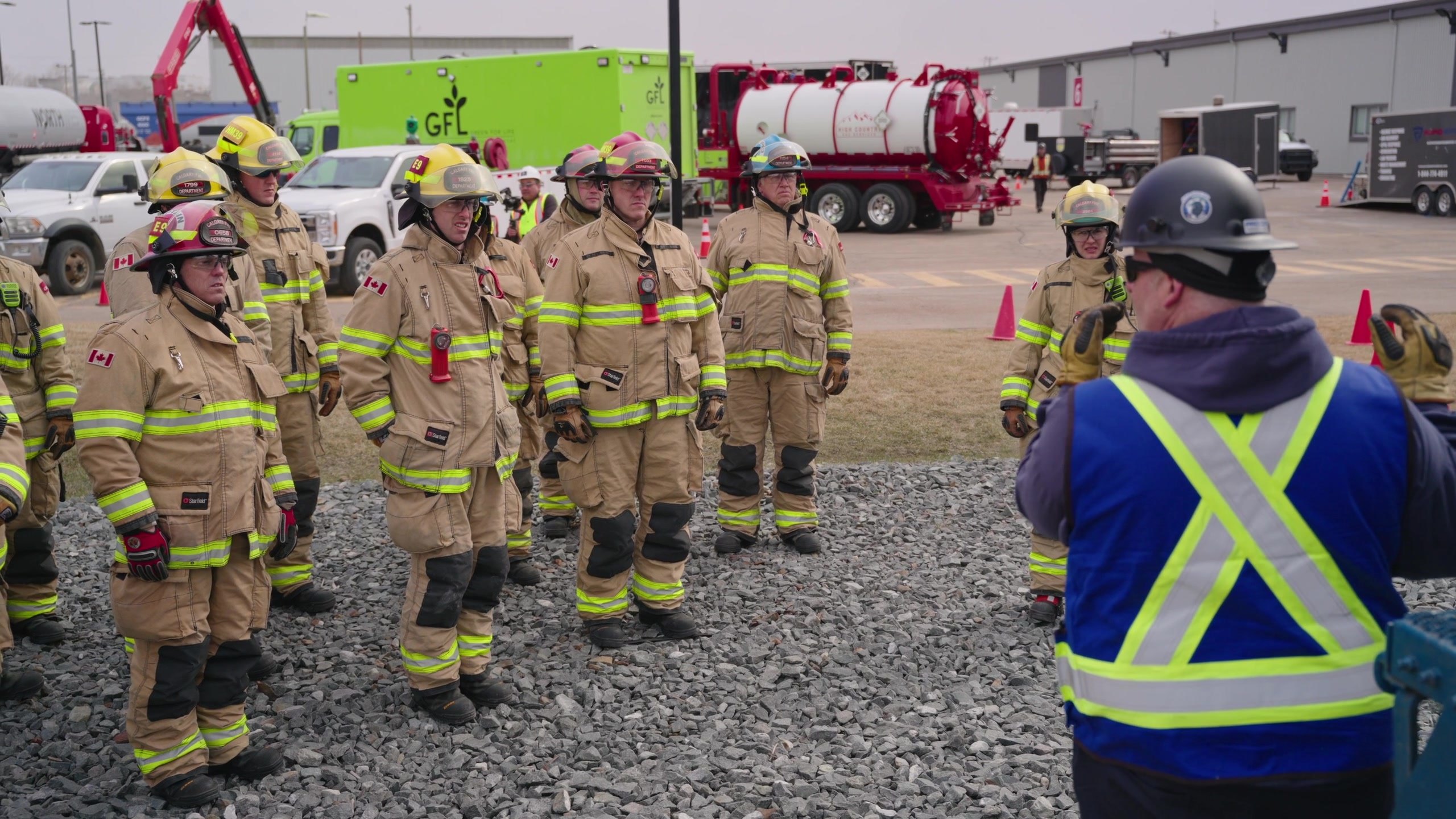 Responders in bunker gear assembled for a session at the CPKC Ogden Campus