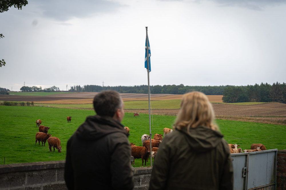 Dr. Robert Coultous and Dr. Eve Hanks at the wall looking out over the herd