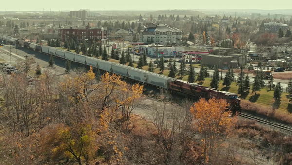 A CPKC unit train passing the heritage row in Calgary