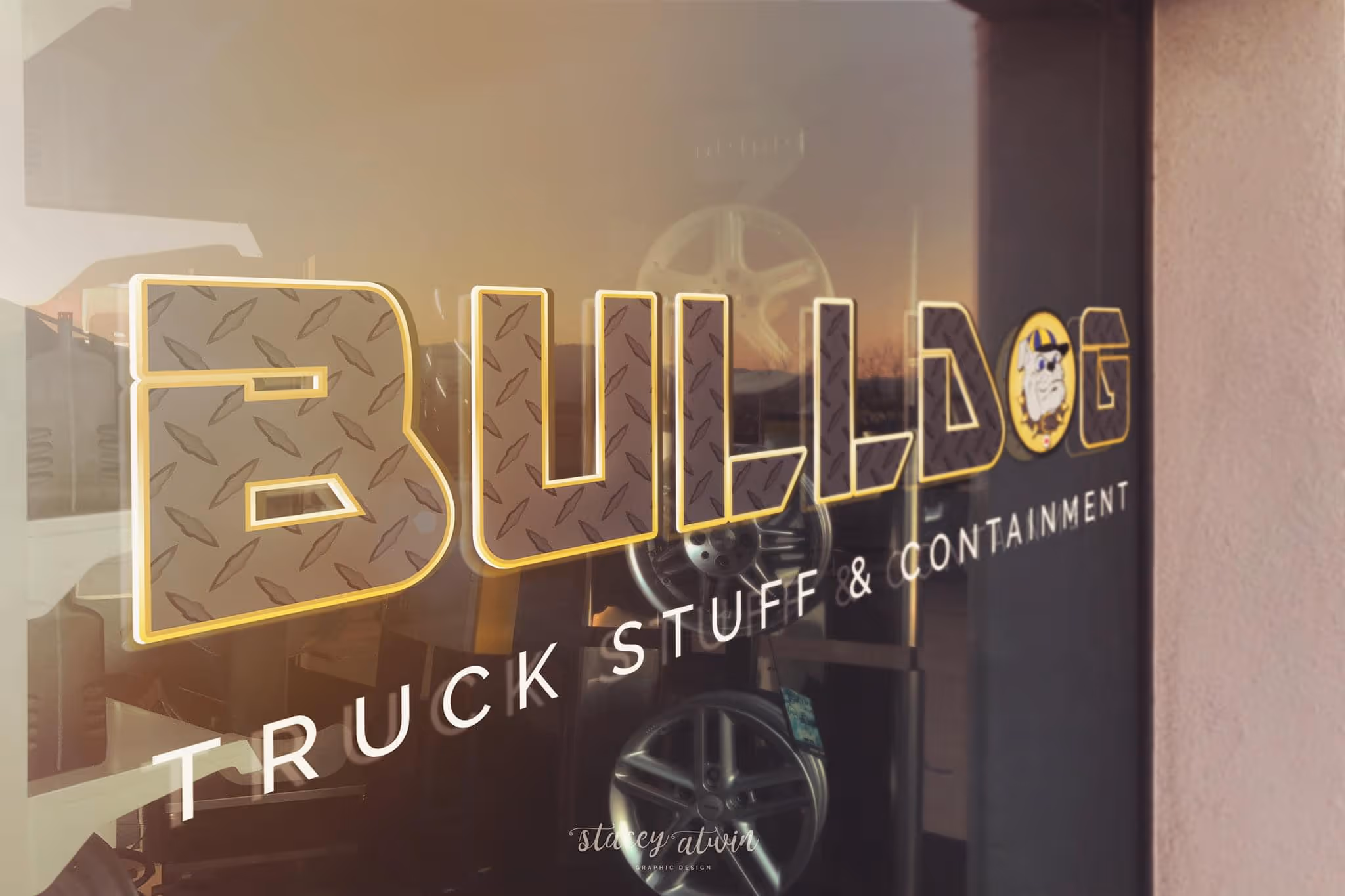 Storefront window with 'BULLDOG TRUCK STUFF & CONTAINMENT' logo and a bulldog cartoon.