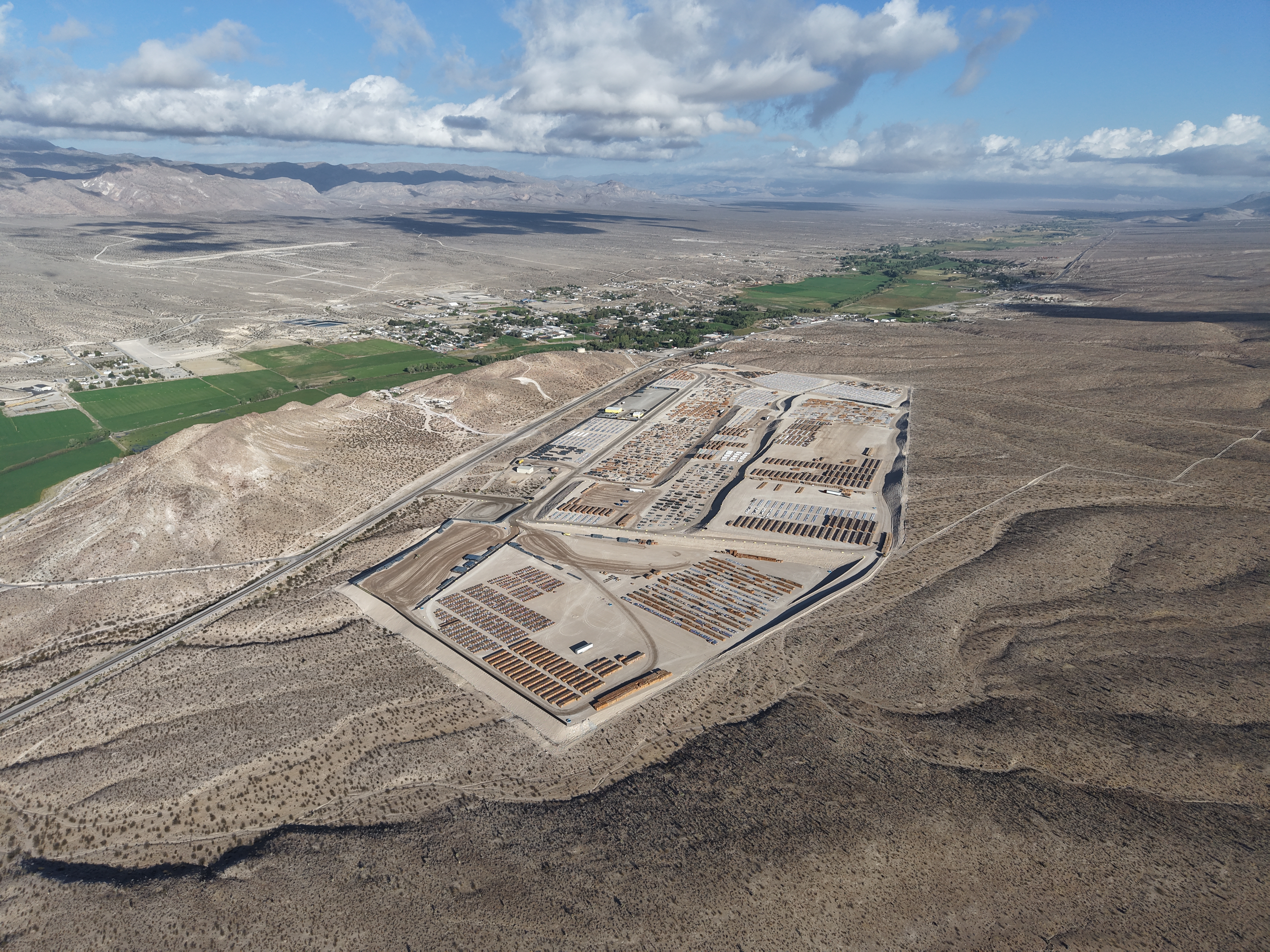 Wide aerial view of the Alamo facility along the US-93 corridor, elevated above the surrounding valley