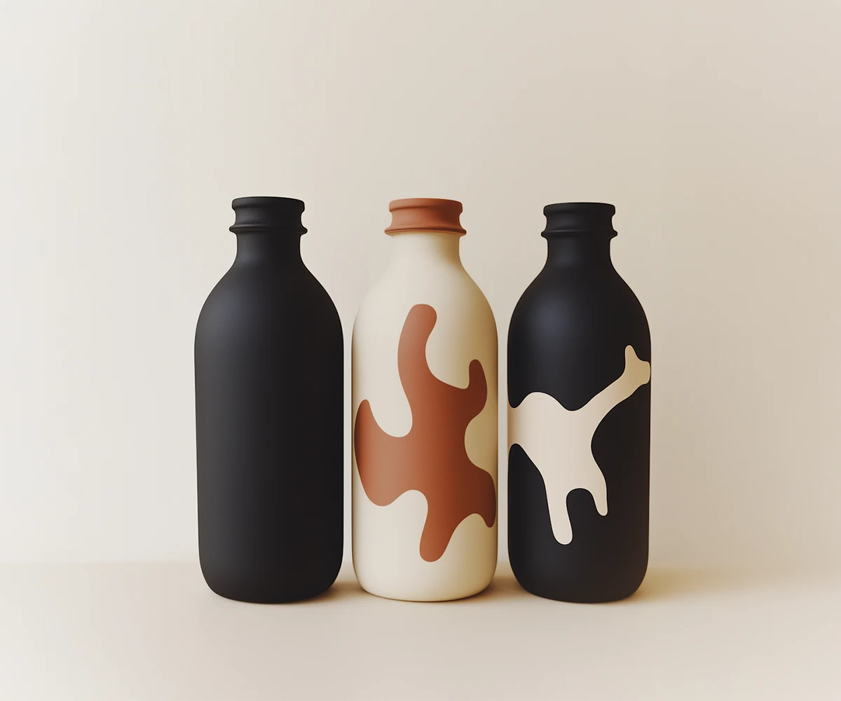 Three matte-finish ceramic bottles with abstract brown and cream patterns on a cream background.