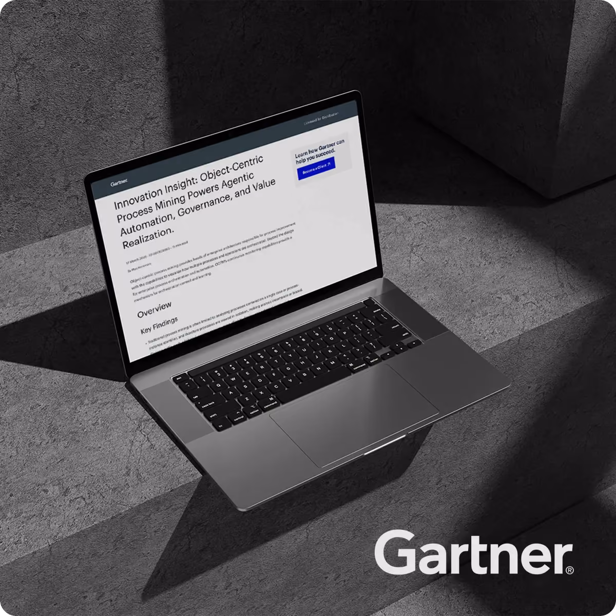 Open laptop showing Gartner report titled about object-centric process mining and automation benefits.