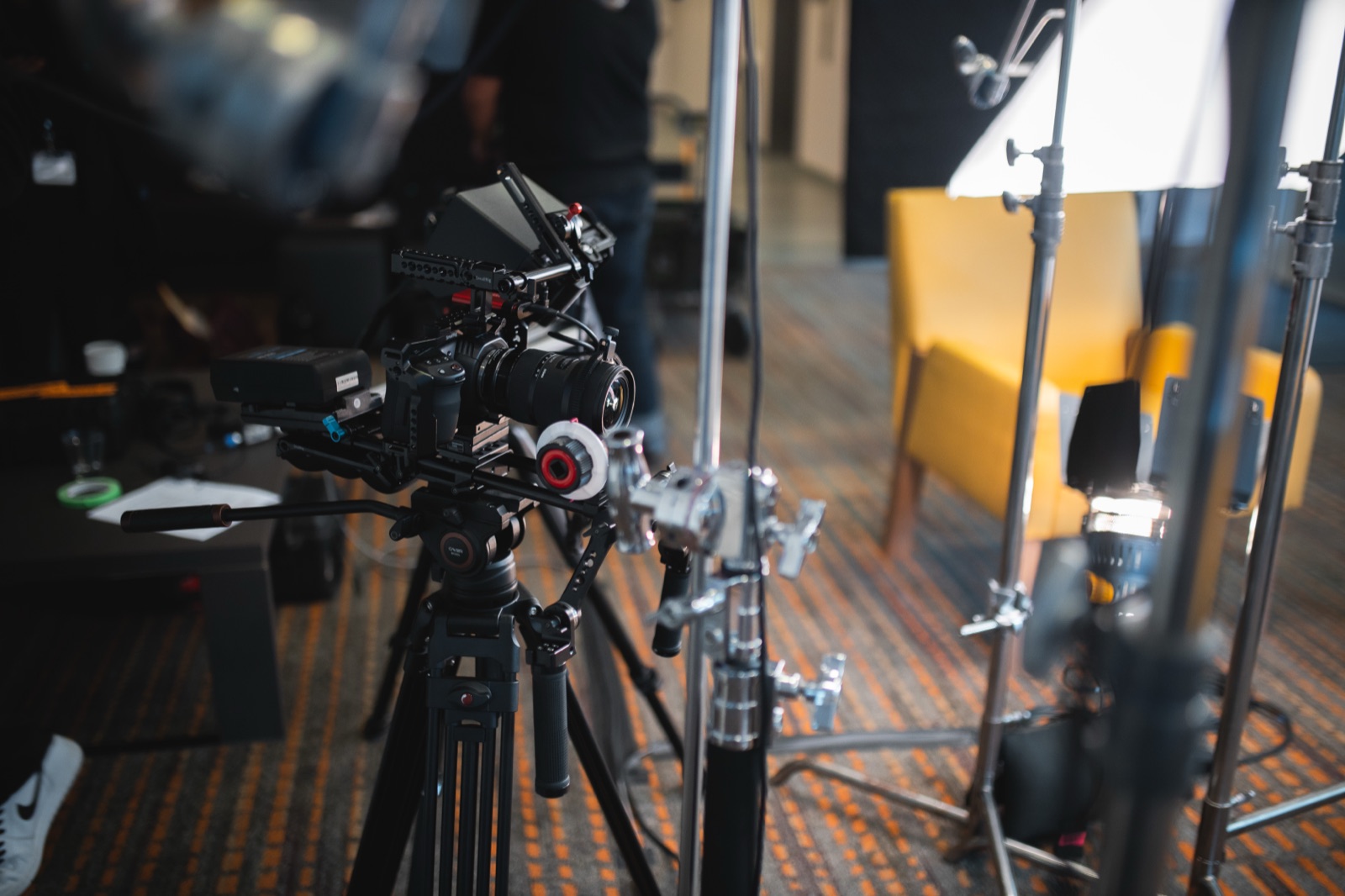 Cinema camera and lighting rig on a NEEBA Studios interview set