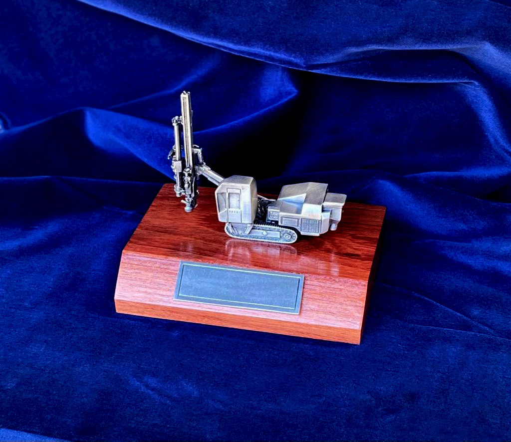 Custom pewter drill rig trophy produced for Perenti Ausdrill mounted on a jarrah timber base