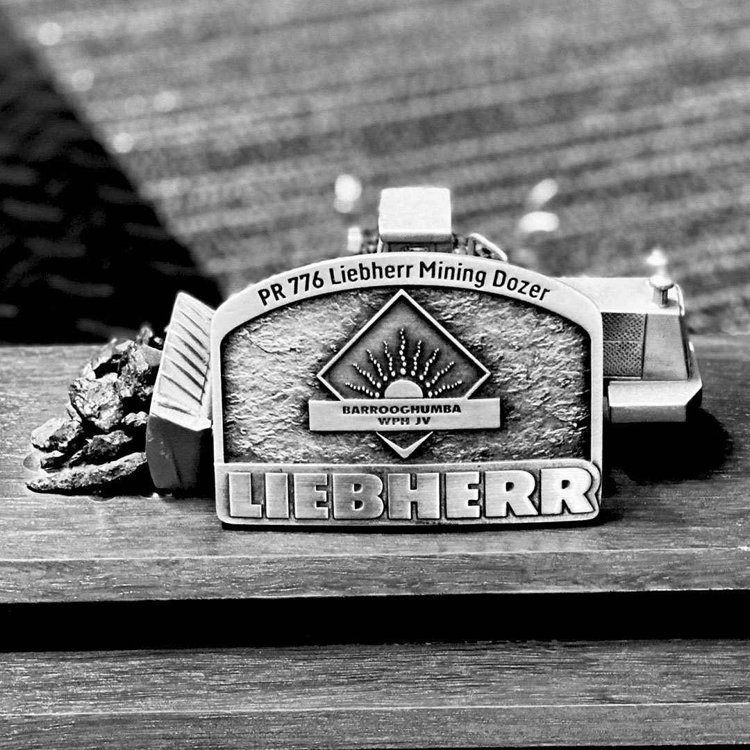 Custom Liebherr mining recognition buckle featuring equipment display and Barrooghumba WPH JV branding