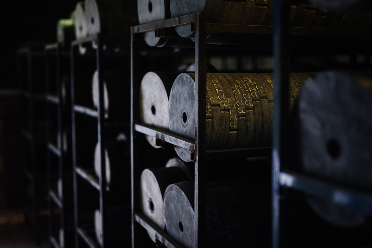 Storage racks holding rubber moulds used to manufacture custom pewter products