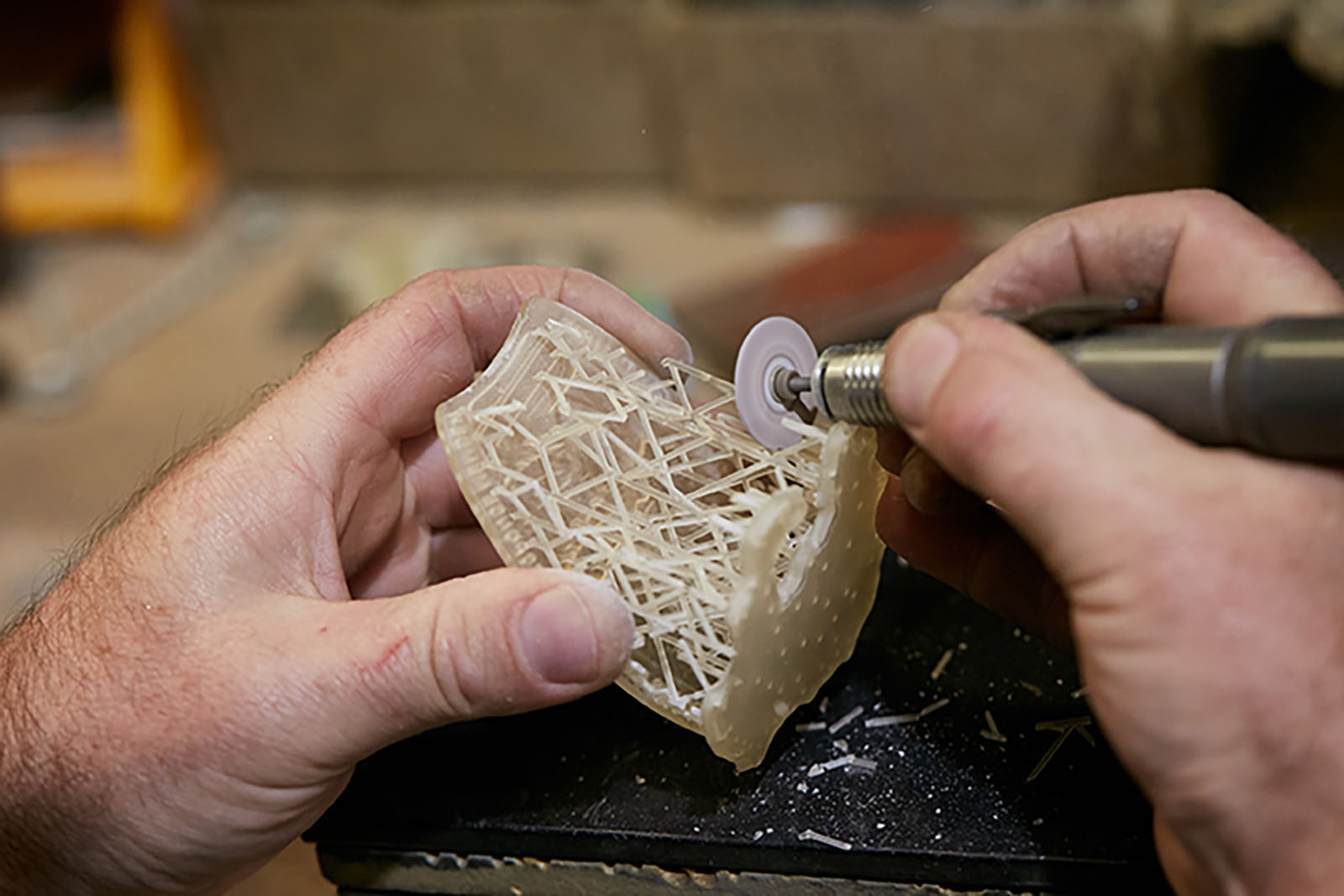 Finishing a 3D printed master by removing support structures before mould production.